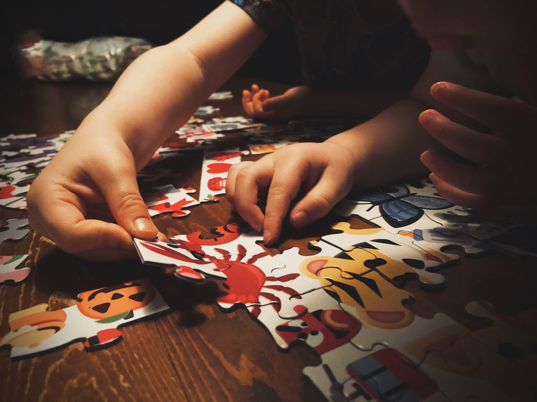 child playing with puzzle game