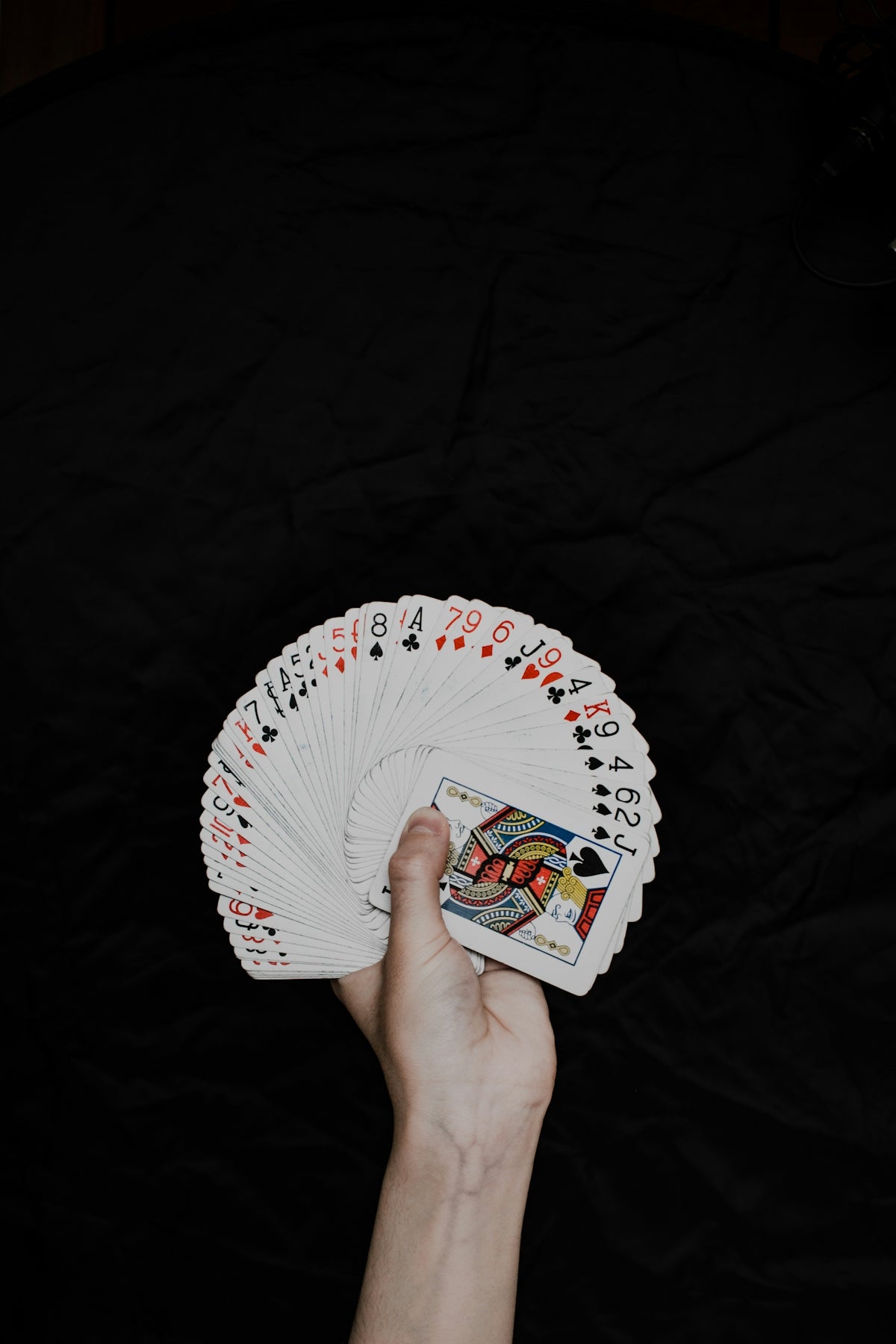 white red and blue round hand fan