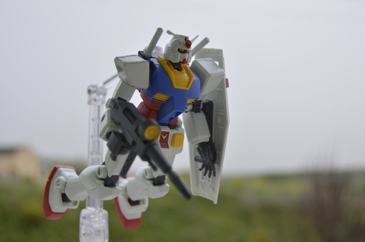 a toy robot that is standing on a pole