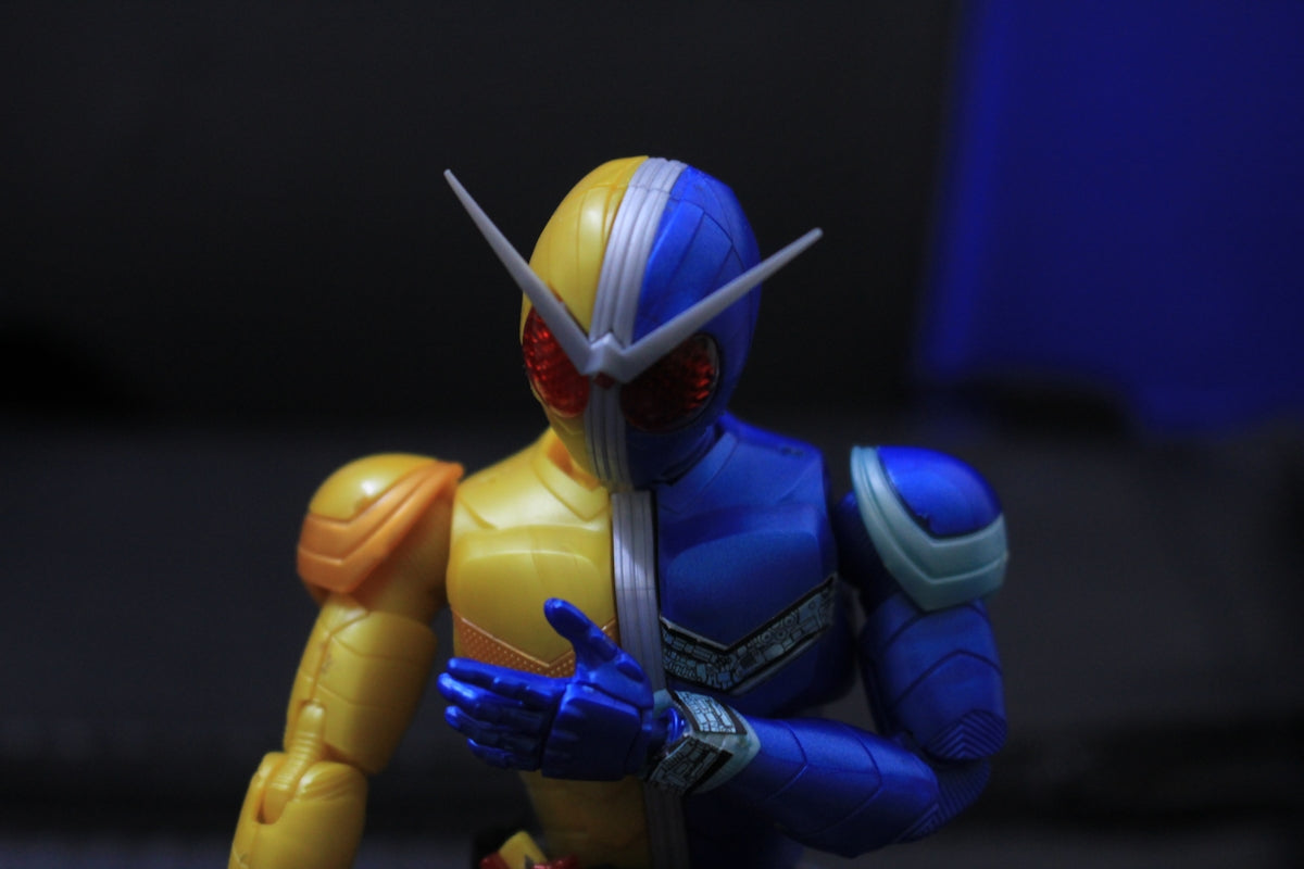 a close up of a toy figure holding a bat