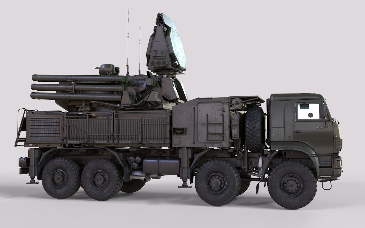 A military truck with a missile on the back of it