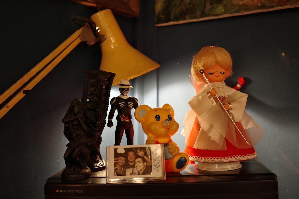 Collection of toys and figures on a shelf.