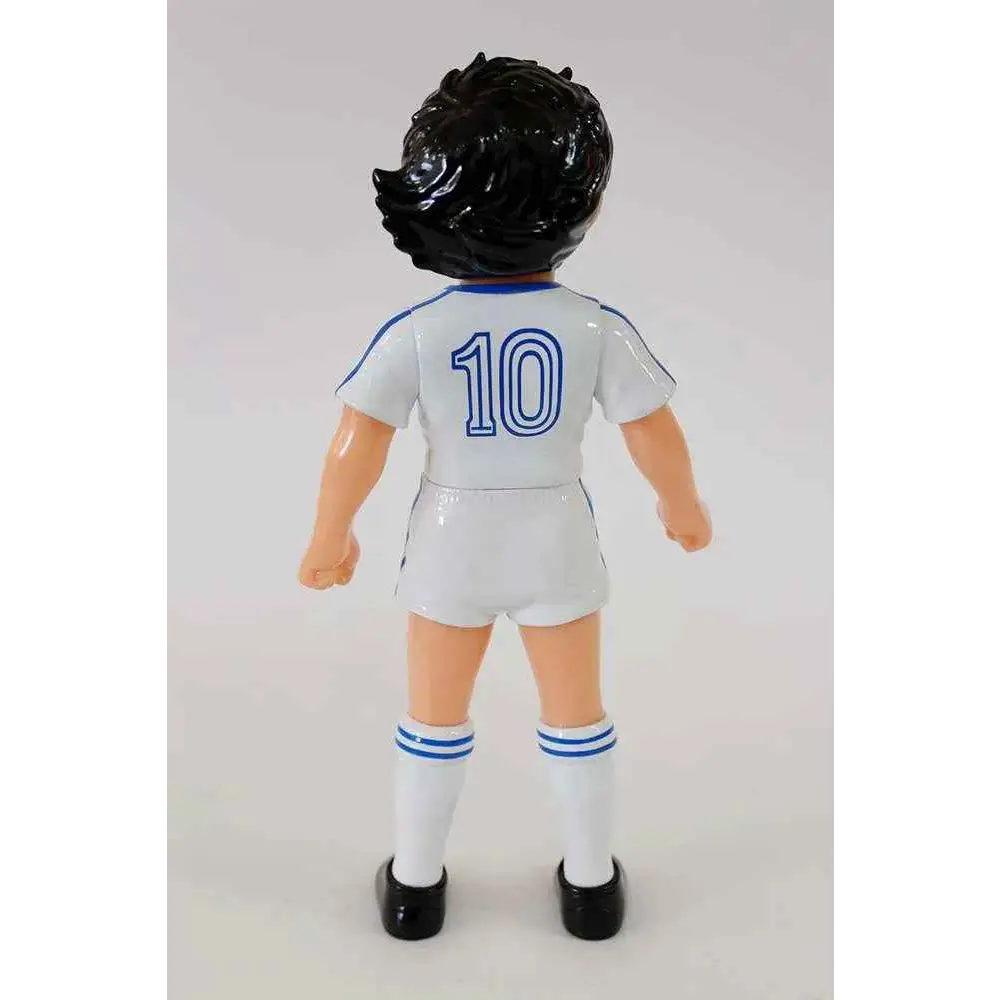 Vit Captain Tsubasa Mjuka vinylfigur: vit plastfigur av fotbollsspelare med svart lockigt hår, vit tröja och shorts med blå kant och nummer 10