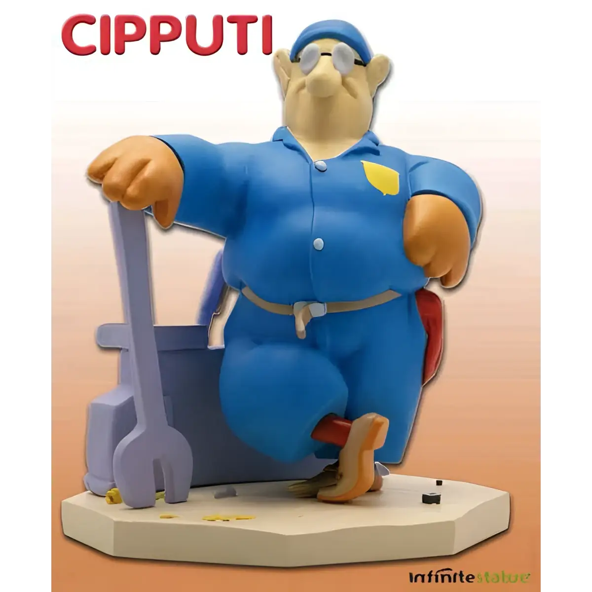 Blå Cipputi-figur i mekanikerkläder med skyddsglasögon och verktygsbälte vid lila verktygslåda