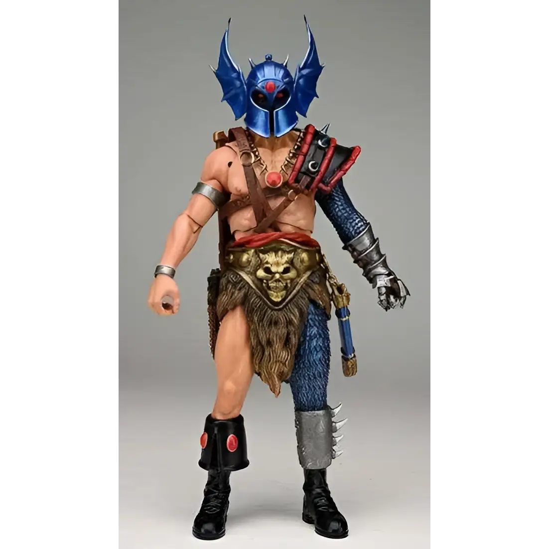 Blå metallhjälmd Warduke-actionfigur med detaljerad rustning och tribal-kläder
