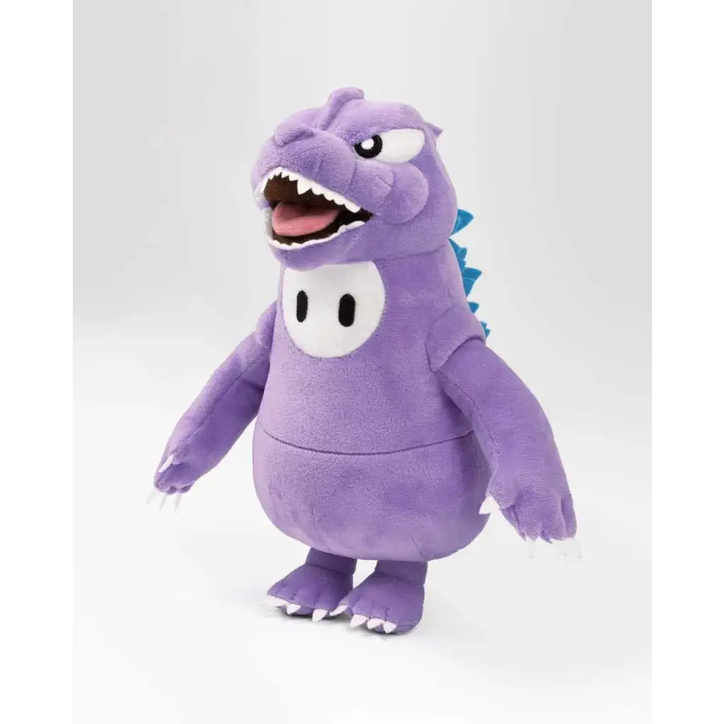 Lila Fall Guys Godzilla-plusch med blå taggar och vitögon, lekfullt uttryck. Hållbar kvalitet