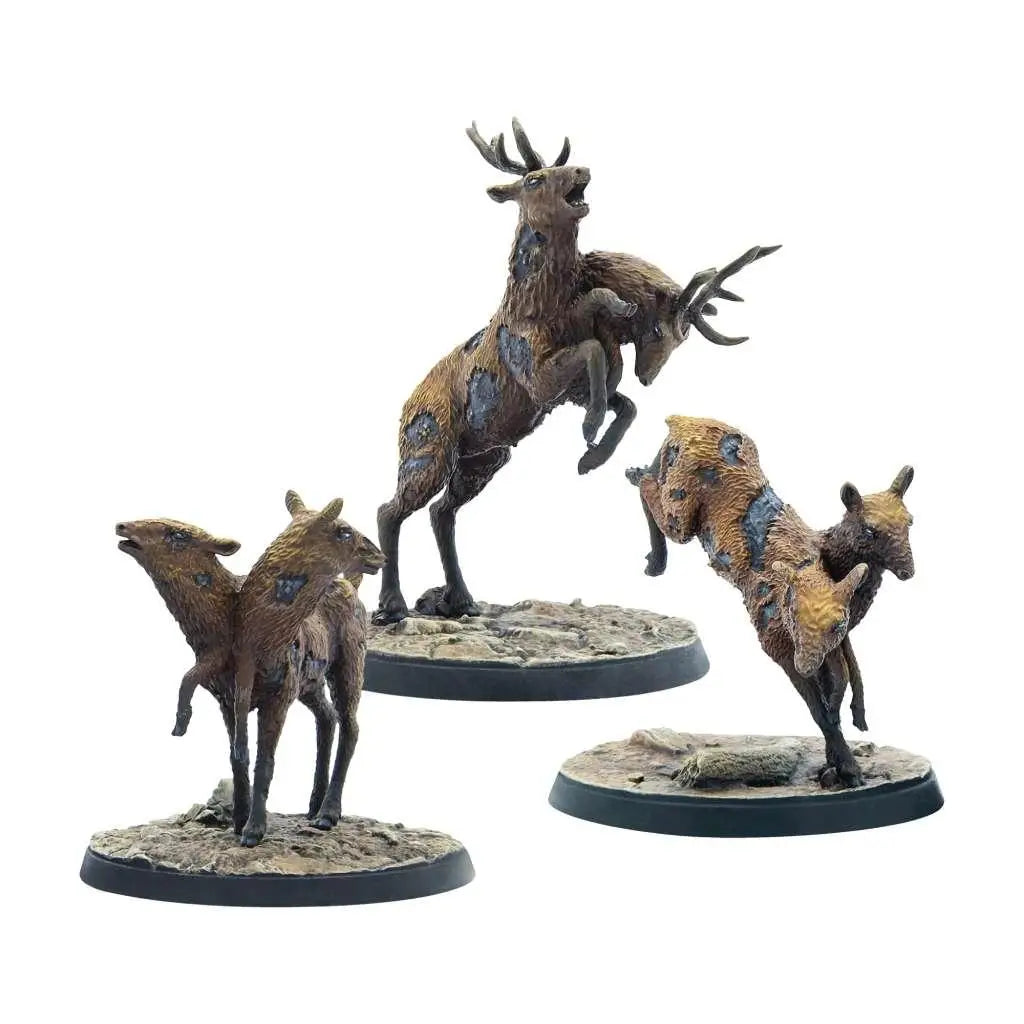 Tre miniatyrfigurer av radstag från Fallout WW Kreaturer, detaljerade på cirkulära baser