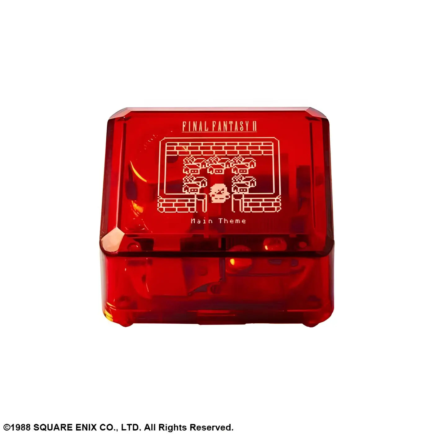 Röd genomskinlig plastlåda med pixelgrafik av Final Fantasy II huvudtema på locket