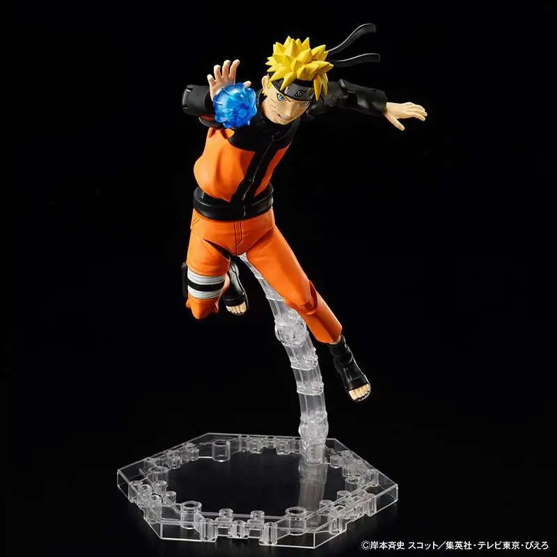 Naruto Uzumaki figur i orange och svart, med spretigt blont hår, orange overall och pannband, i luften med blå chakra-kula