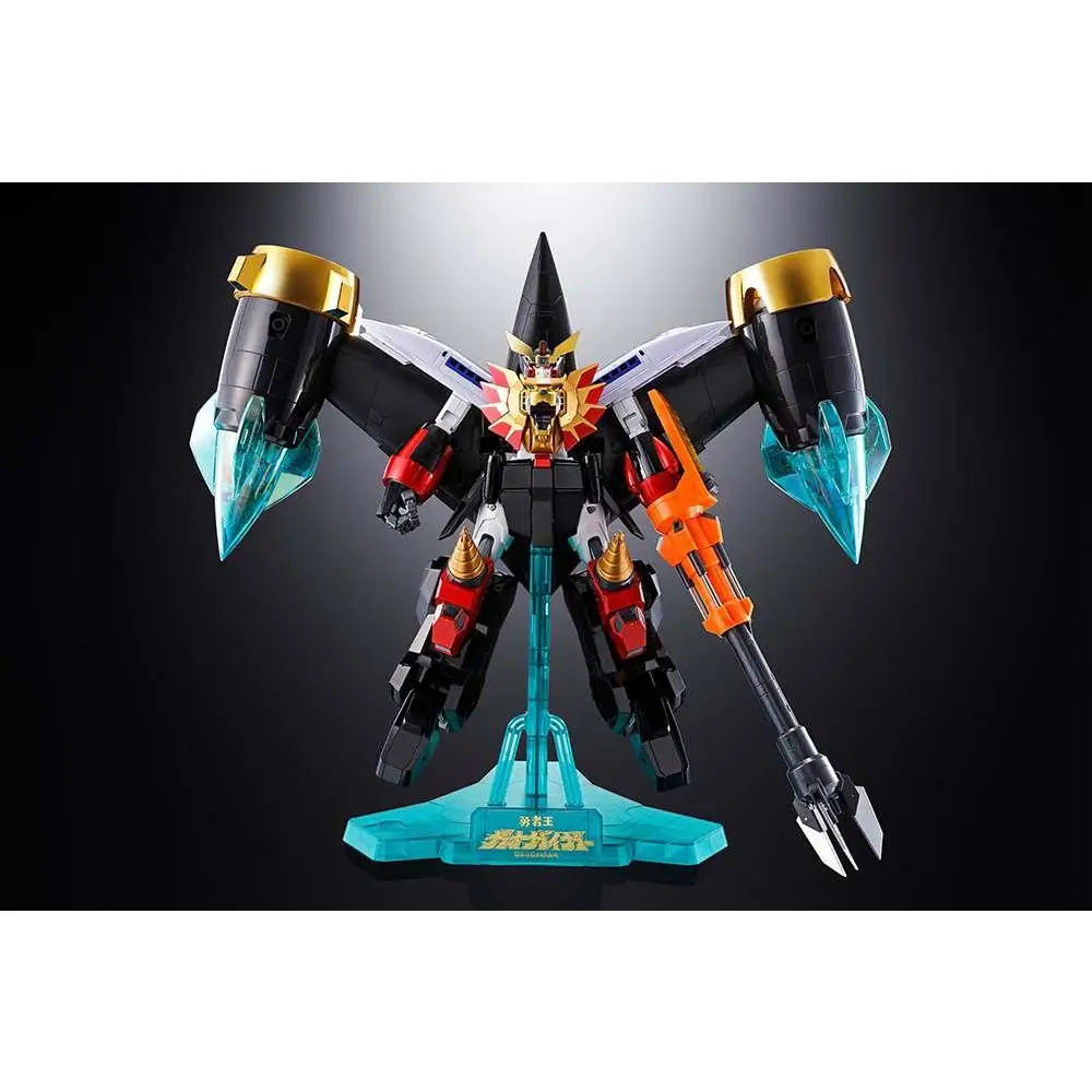 Svart, röd och guld robotfigur med transparenta turkosa vingar och vapen från Gx-68X Star Gaogaiger Option Set