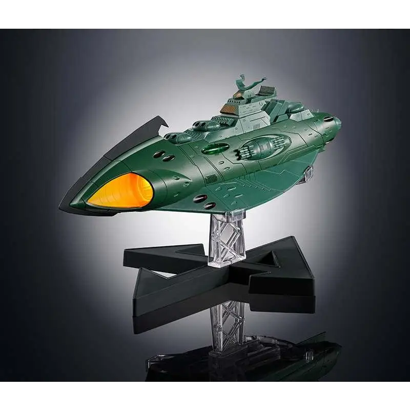 Gx-89 Garmillas rymdkryssare: grön plastmodell med orange lysande kabin på klar svart stativ