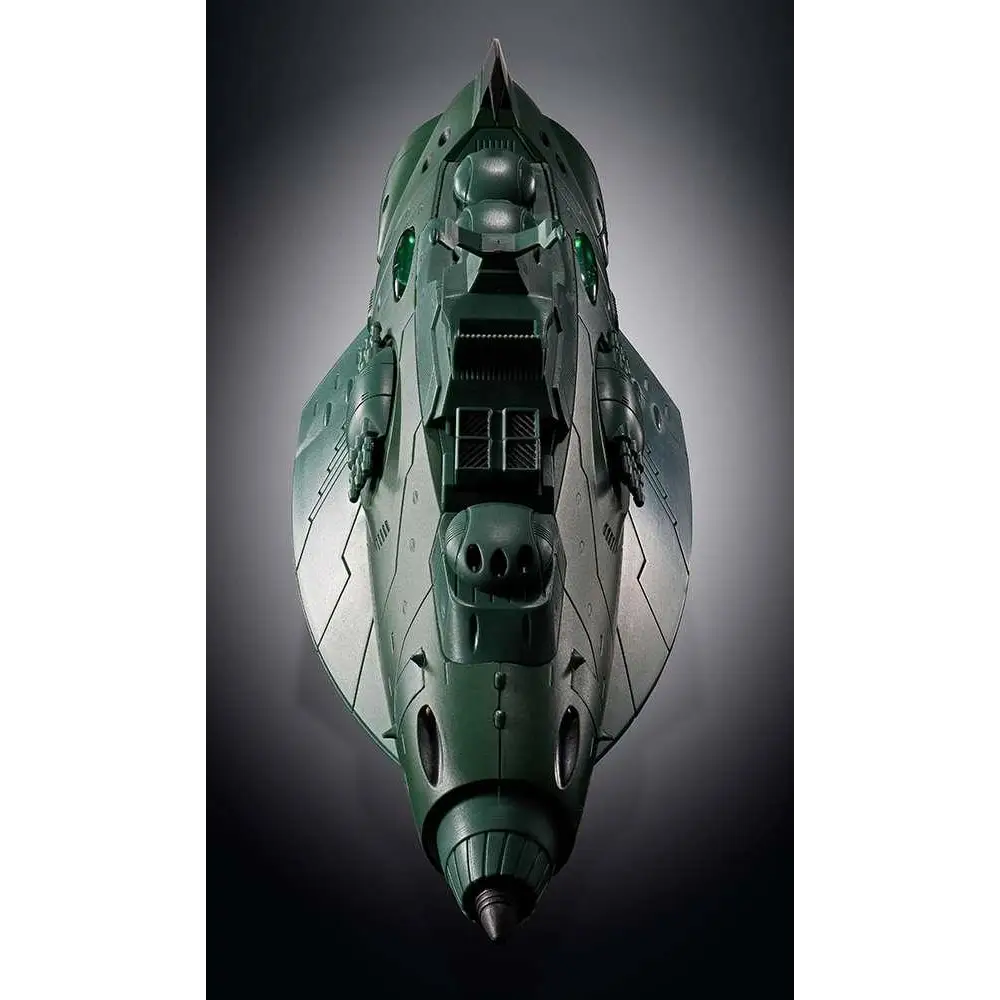 Mörkgrön plastmodell av futuristiska Gx-89 Garmillas rymdfarkosten med vinklad design och lysande gröna cockpitlampor