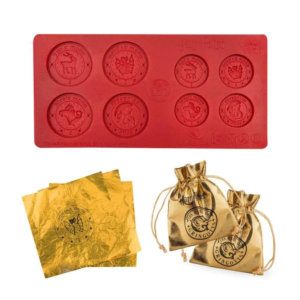 Röd silikonform med Hogwarts-emblem och guldfolie för Gringotts chokladset
