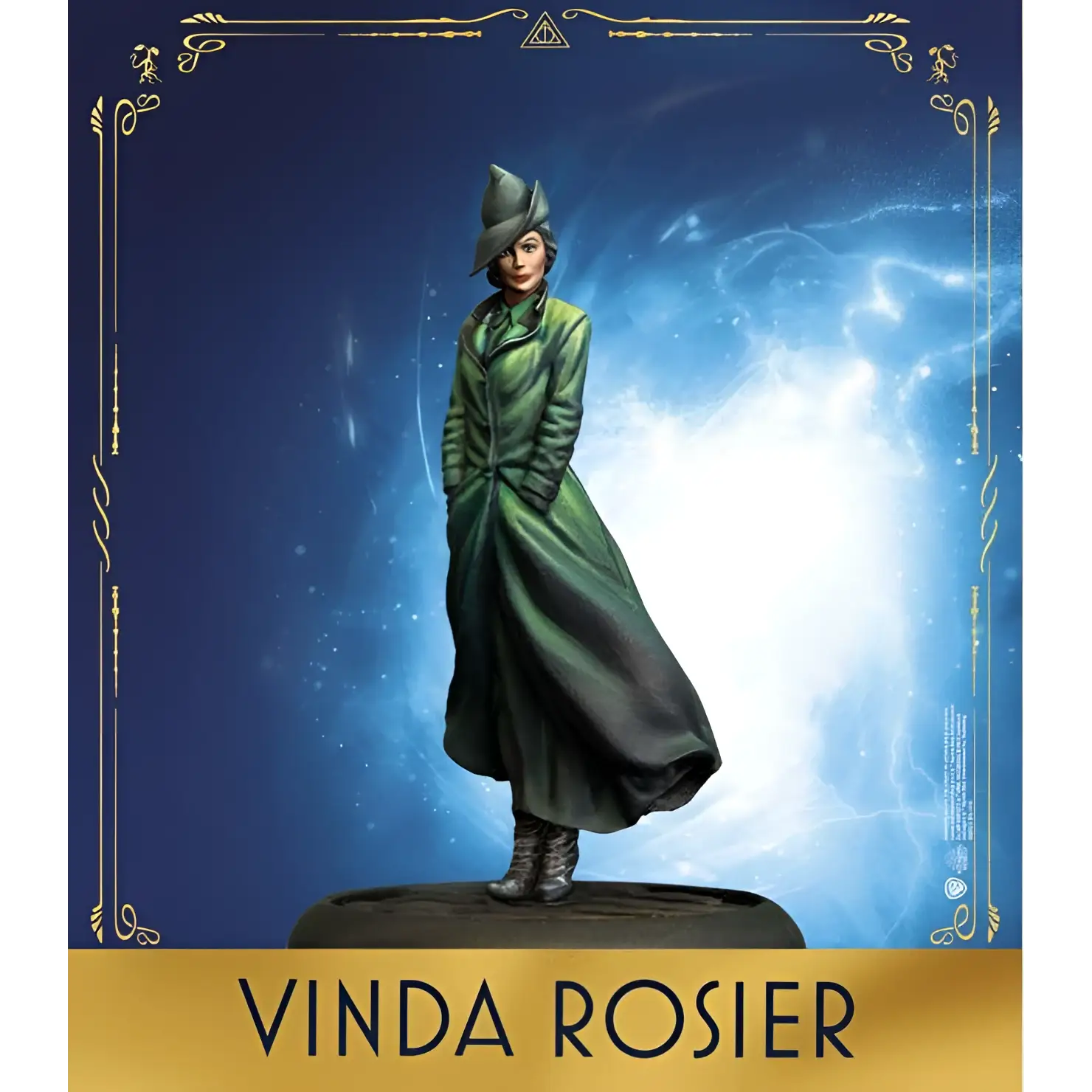 Vinda Rosier miniatyr i grön mantel och hatt mot kosmisk blå bakgrund