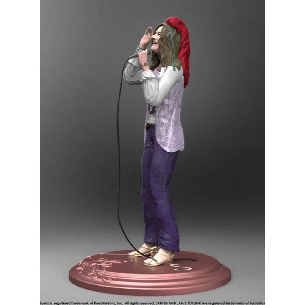 Janis Joplin rockikonstatyett med röd huvudduk och mikrofon