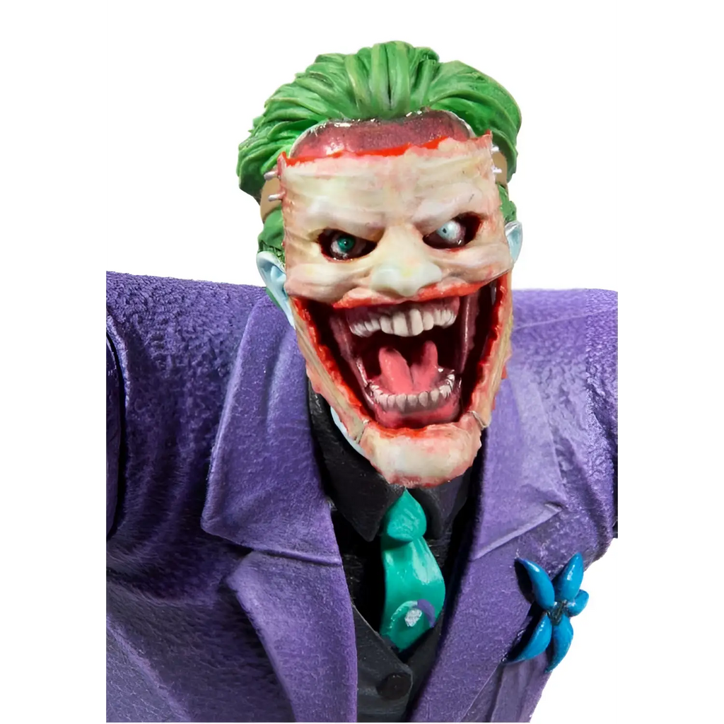 Lila Joker-statyn med lila kostym, gröna taggiga håret och turkos slips