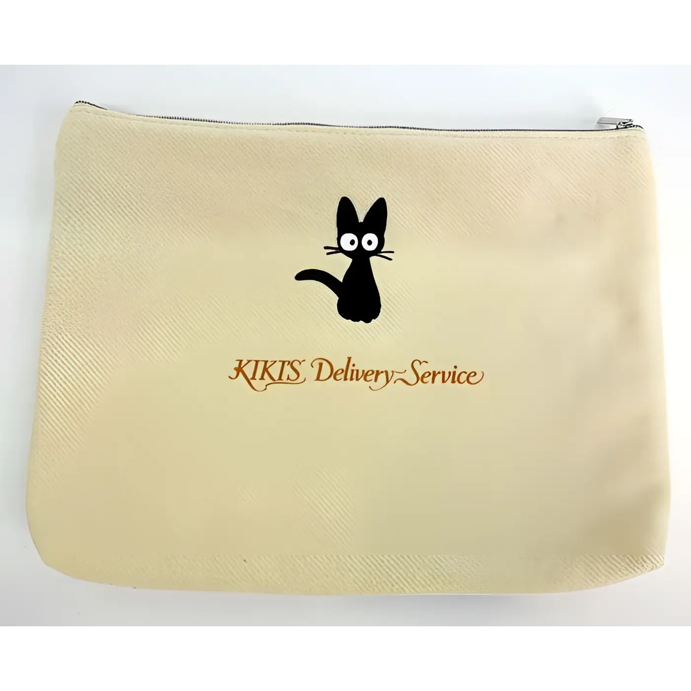 Beige canvasväska med svart Kiki-kattsiluett och orange Kiki’s Delivery Service-text