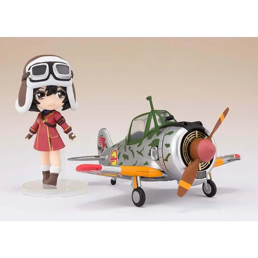 Silvergrön kamouflage leksaksflygplan med orange accenter, Kotobuki Squadron Kylie & Hayabusa Mini FG Figur