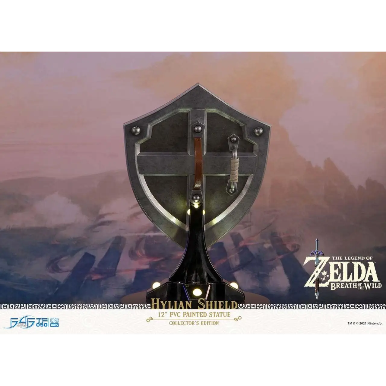 12-tums målad PVC-statett av Hylian-skölden från Legend of Zelda: Breath of the Wild, metallgrå med detaljerade nitar och central korsskydd