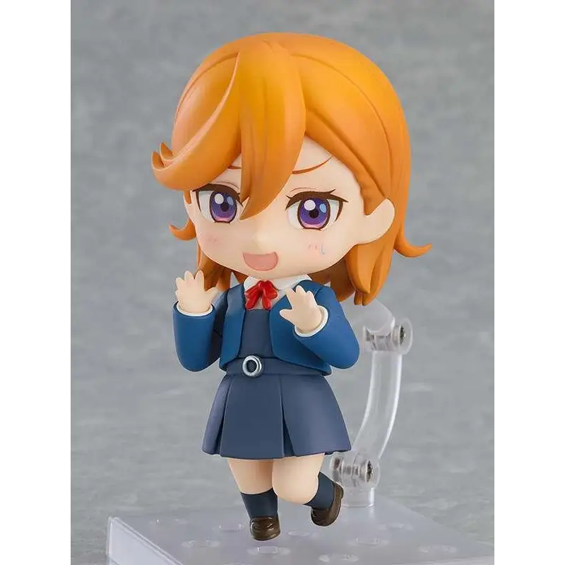 Orange-haired anime girl Nendoroid figurine in blue uniform, red bow tie, brown shoes