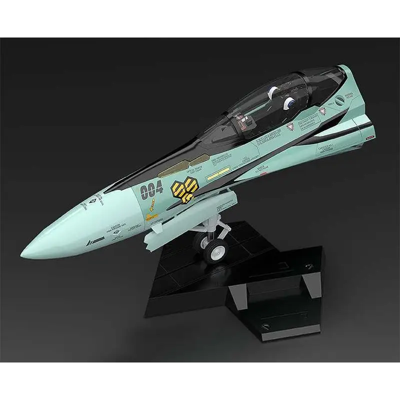 Mintgrön och svart Macross Plamax MF-59 RVF-25 stridsflygplan med gul hexagoninsignia på en svart stativ