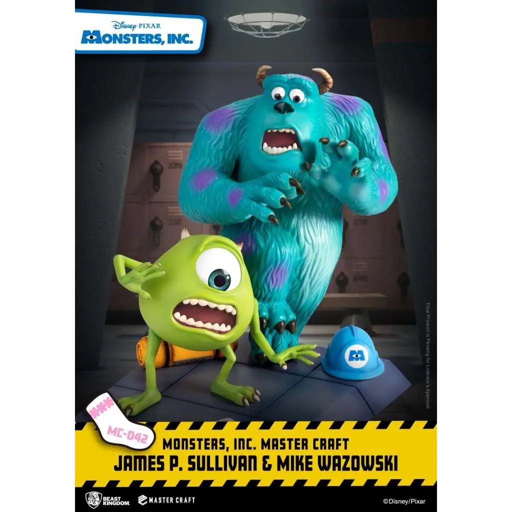 Blå och lila fläckig monsterfigur med horn bredvid grön enögd varelse, Monsters Inc. Sully och Mike Master Craft-staty