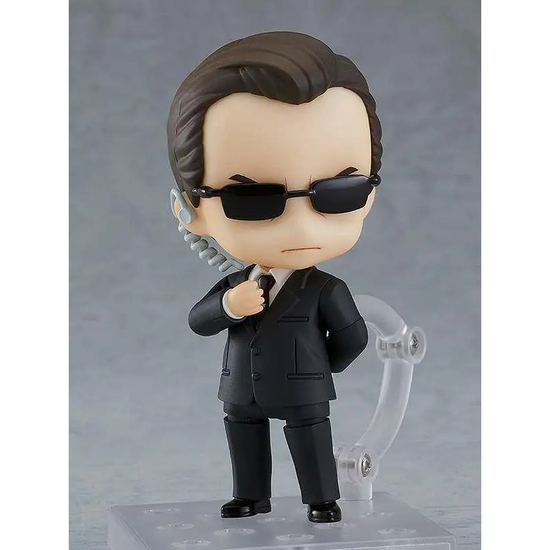 Nendoroid Agent Smith figur från The Matrix i svart kostym med brun hår och svarta solglasögon, med spiraltelefonkabel från örat