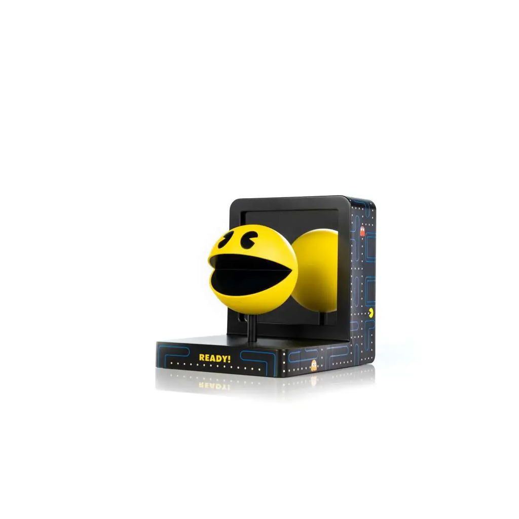 Gul Pac-Man PVC-staty med svarta ögon och mun på svart bas med texten Ready! för 40-årsjubileum