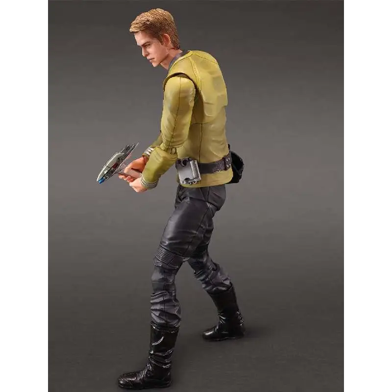 Gul jacka Play Arts Kai Captain James T. Kirk actionfigur med svarta byxor och stövlar, håller silver och blå handhållen enhet