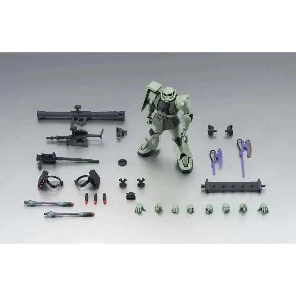Sammanställd grön och grå MS-06 Zaku II-modell med detaljerad rustning och distinkt huvud