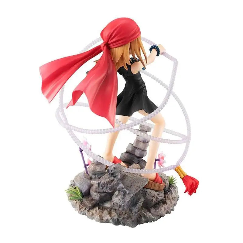 Röd huvudduk-inbunden Anna Kyoyama-figur från Shaman King på klippig terräng med vita ringar