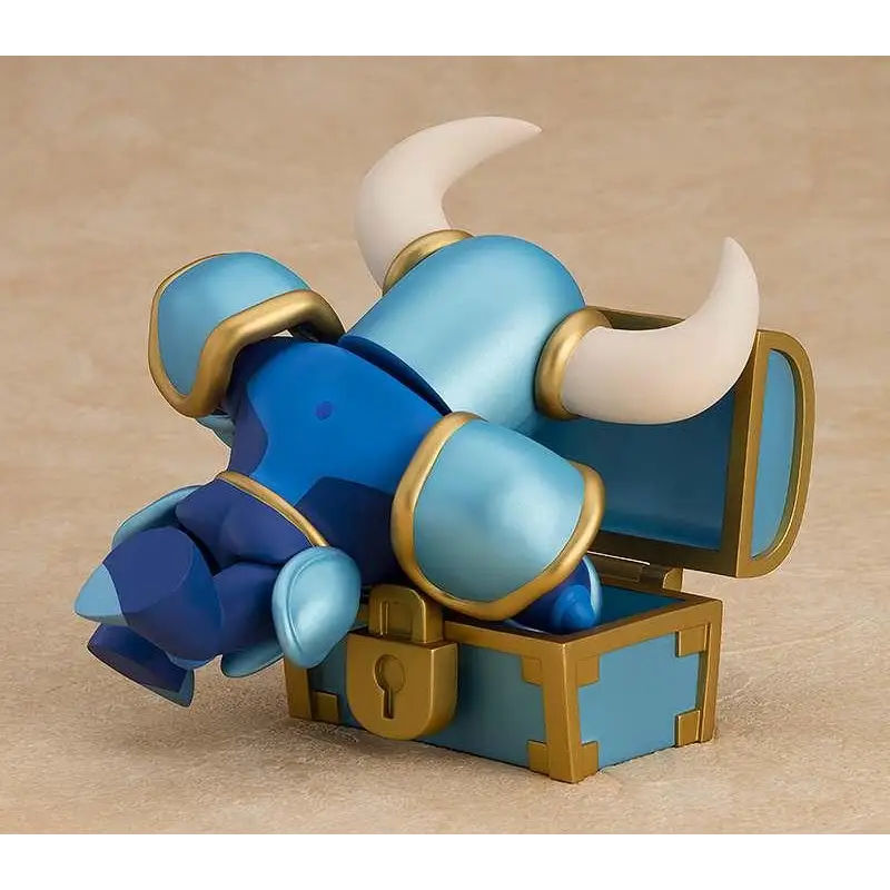 Blå och gul rustad tjurfigur med vita horn på öppen skattkista, Shovel Knight Nendoroid