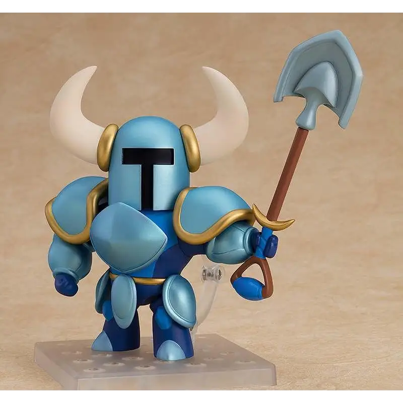 Blå och gul riddarfigur i rustning med vita horn, håller spade – Shovel Knight Nendoroid