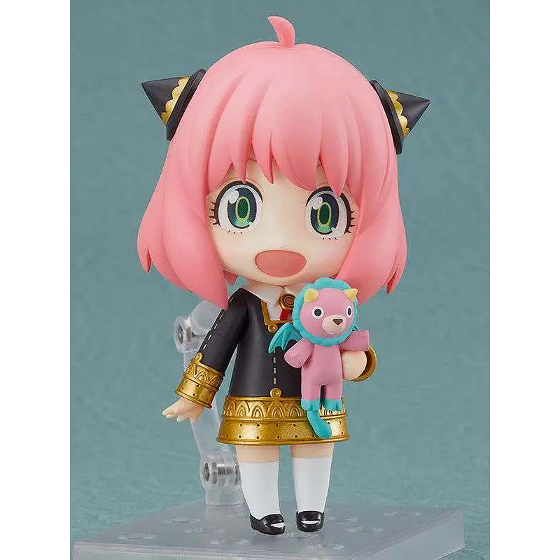 Nendoroid Anya Forger: rosa hår, gröna ögon, svart-guld outfit, rosa teddybjörn