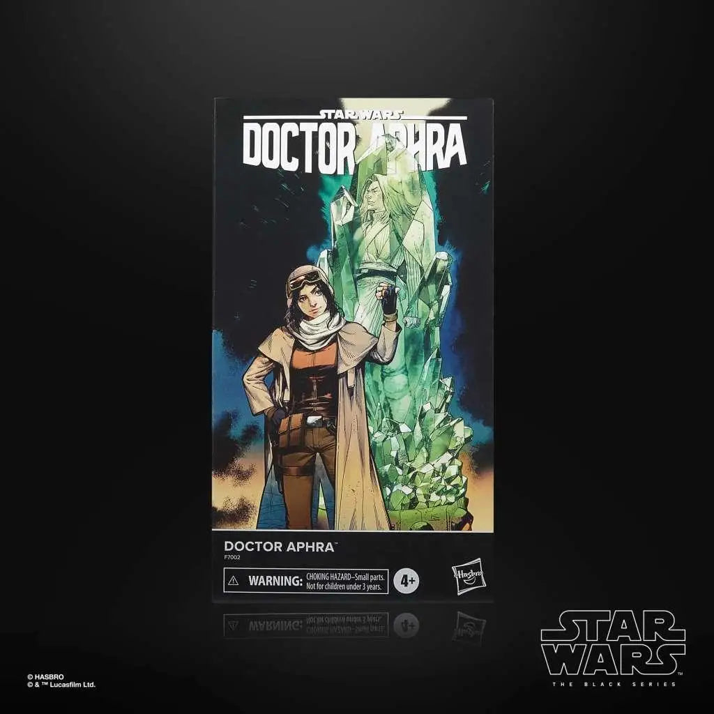 Star Wars The Black Series Doctor Aphra actionfigur i förpackning med brun-tan klädsel mot gröna kristaller