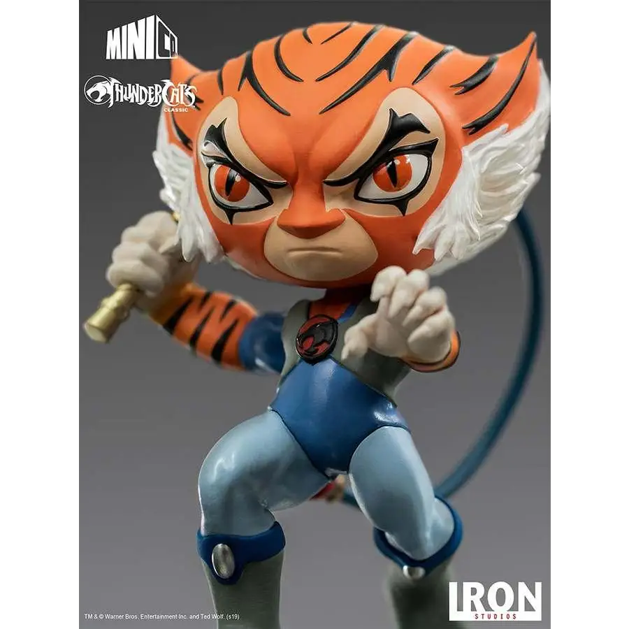 Tygra Thundercats-figur i orange-svart randig tigerdesign med blå rustning