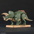 Grön triceratops byggsats och figur med beige horn och frill på tan bas