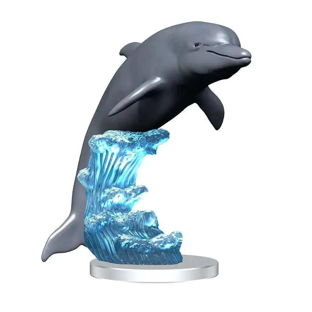 Grå delfinfigur med genomskinliga blå vågor under, på silverbas. Wizkids Deep Cuts